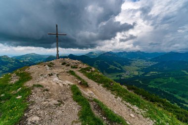 Mountain tour in Schattwald from the Wannenjochbahn to the Kuhgrundkopf in the Tannheimer Tal clipart