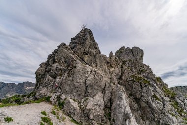 Beautiful mountain tour in Bad Hindelang to the Breitenberg and Rotspitze summit with a short via ferrata over the Hohe Gaenge clipart