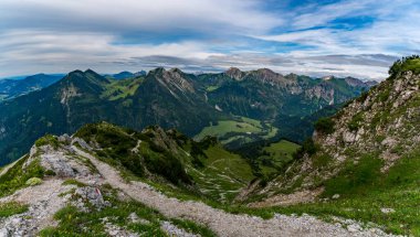 Explore the stunning landscape of the Allgau Alps from the summit of Rotspitze ideal for hiking and climbing enthusiasts clipart