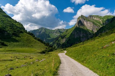 Wonderful high-altitude hike from the Nebelhorn Edmund-Probst-Haus via the Laufbacher Eck to the Oytal in the Allgau Alps near Oberstorf clipart