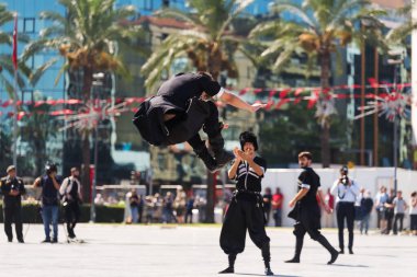 Izmir, Turkey - September 9, 2022: Group of young people performing dance at the Republic Square in Izmir Turkey and on the liberty day of Izmir. clipart