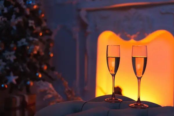 Close Shot Two Champagne Glasses Filled Champagne Front Fireplace Christmas — Stock Photo, Image