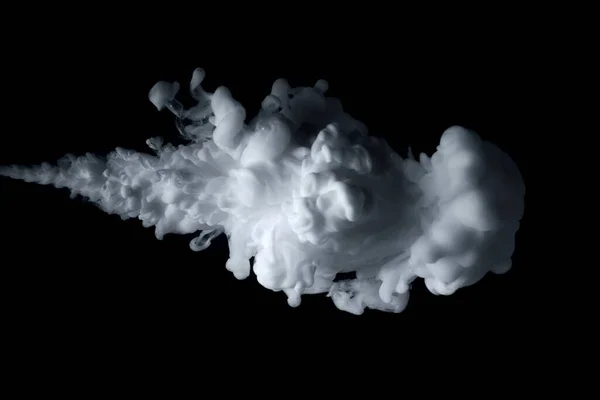 stock image Close up shot of paint cloud spraying on a black background.