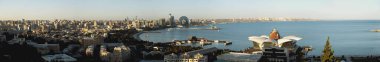 Baku, Azerbaijan - June 26, 2023: A breathtaking panorama of Baku's skyline featuring the iconic Crescent Hotel, as seen from the historic Maiden Tower