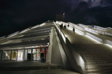 Tirana, Albania - November 28, 2023: Nighttime photograph of the Tirana Pyramid, illuminated against the dark sky