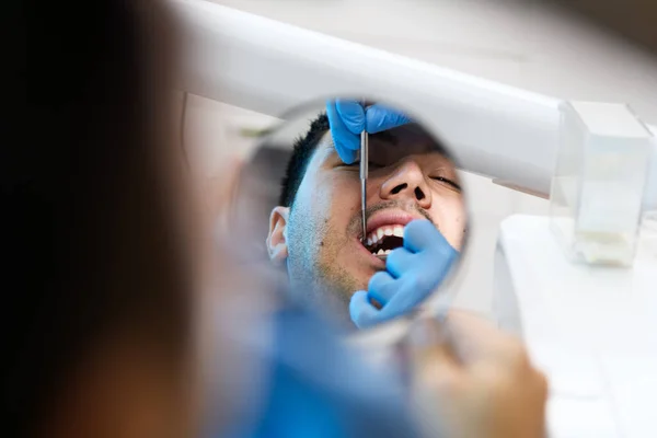Patient Examines His Smile Mirror Dental Checkup Showcasing Close Personal — Stock Photo, Image