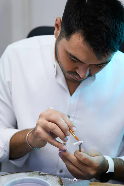 Close Technician Hands Meticulously Applying Porcelain Dentin Dental Prosthesis Using — Stock Photo, Image