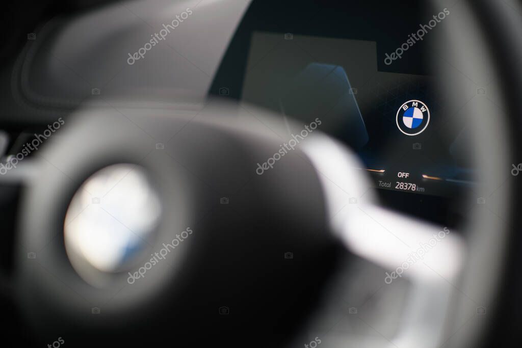 Izmir, Turkey - Apr 1 2025: Close-up photo of BMW logo displayed on the digital driver screen of BMW X1 S Drive 2.0i 2024 with a transparent background.