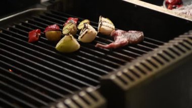 Close-up slow motion of perfectly grilled lamb chops with mouthwatering juices and crispy edges