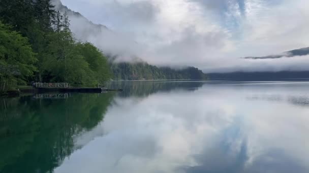 Completely Still Beautiful Reflecting Water Wooden Dock Low Clouds Forest — Stock Video