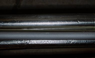 Thermal insulation of plumbing communications in darkness of house basement