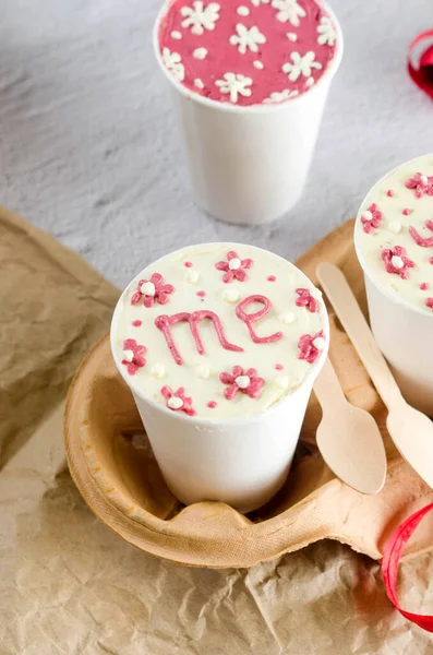 stock image homemade mini cake in white disposable coffee cups, new confectionery trend. Paper cups with cakey  are in a box, fashionable dessert