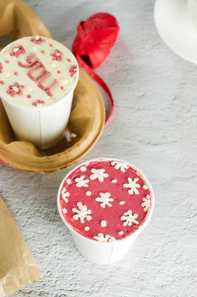 stock image homemade mini cake in white disposable coffee cups, new confectionery trend. Paper cups with cakey  are in a box, fashionable dessert