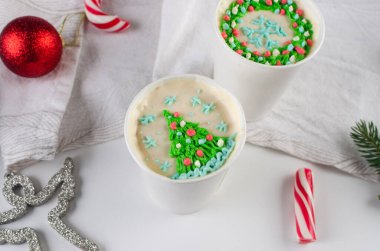 Xmas idea dessert, homemade mini cake in white disposable coffee cups, new confectionery trend. Paper cups with cakey  are in a box, fashionable dessert. Home baking idea for holidays. small business clipart