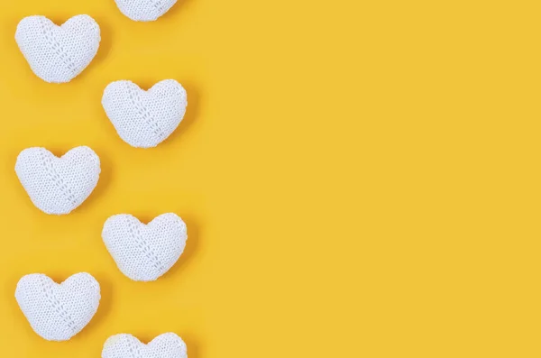 Many White Knitted Hearts Yellow Background Concept Valentine Day Greeting — 스톡 사진