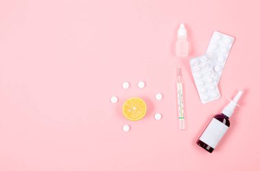 Medicines for treatment- pills, spray bottles, thermometer, Lemon, ginger and tea. traditional and folk methods of treatment. Pharmaceuticals and medicine. Illness concept. 