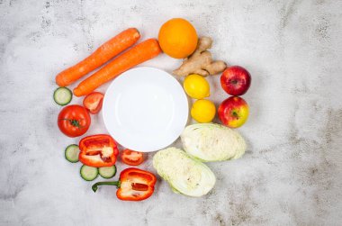 Seasonal Fresh fruit and vegetables on grey background, Vegetarian and vegan diet. Sustainable lifestyle, good, real plant-based foods. Veganuary concept