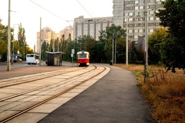 A vintage tram gliding through a city street. Perfect for urban photography, travel, and historical themes. clipart