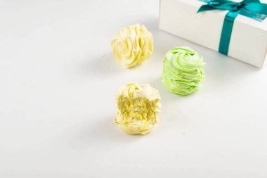 Colorful zephyrs on a white background. Perfect for food photography, dessert, and sweet treats. clipart