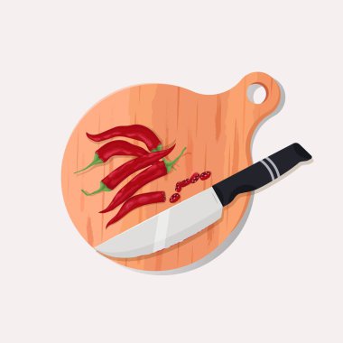 Dilimlenmiş kırmızı biberli tahta ve bıçak.