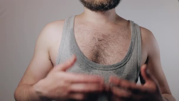 Close Slow Motion Shoot Man Shirt Soaked Sweat Fans Himself — стоковое видео