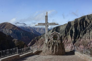 Religious viewpoint with mountains in the background in  Iruya, Salta Province of northwestern of Argentina. Iruya is located in the altiplano region along the Iruya river at an elevation of 2780 meters clipart