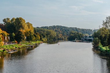 Autumn landscape, colored trees over the river, beautiful picturesque background. Natural paints. Beautiful view. river autumn trees shore sky. mountain landscape at the lake in autumn. trees in