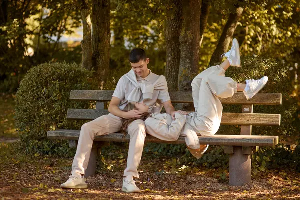 Stock image Young Cute Female Hugs Boyfriend. In Autumn Outdoor. Lovers Walking in Park. Attractive Funny Couple. Lovestory in Forest. Man and Woman. Cute Lovers in the Park. Family Concept. Happy Couple.