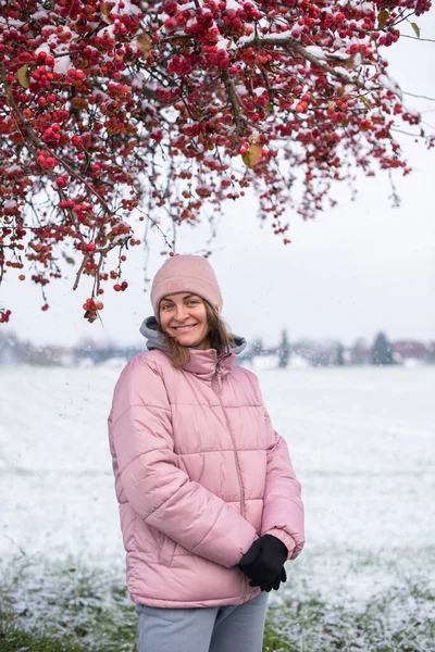 stock image Winter Elegance: Portrait of a Beautiful Girl in a Snowy European Village