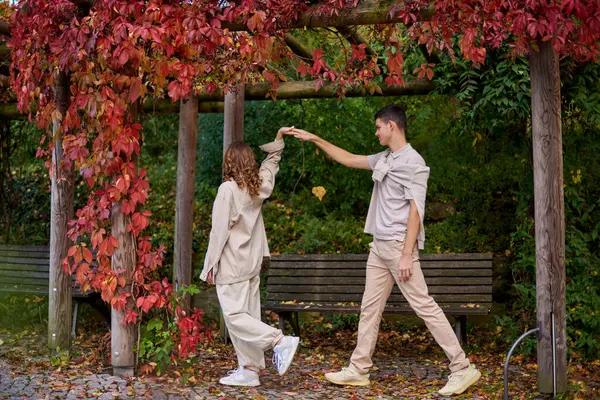 stock image Young Cute Female Hugs Boyfriend. In Autumn Outdoor. Lovers Walking in Park. Attractive Funny Couple. Lovestory in Forest. Man and Woman. Cute Lovers in the Park. Family Concept. Happy Couple.