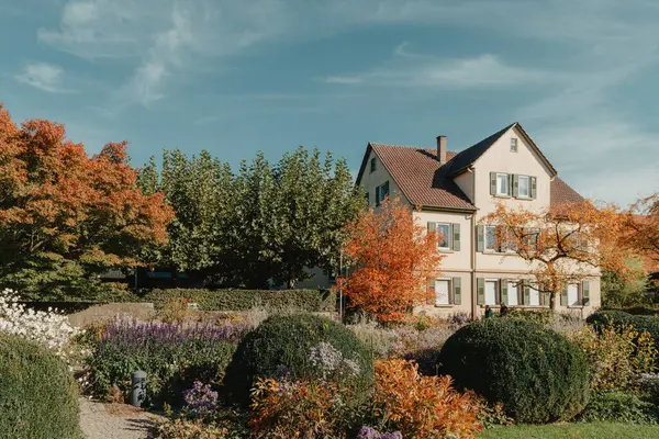 stock image House with nice garden in fall. Flowers in the Park. Bietigheim-Bissingen. Germany, Europe. Autumn Park and house, nobody, bush and grenery