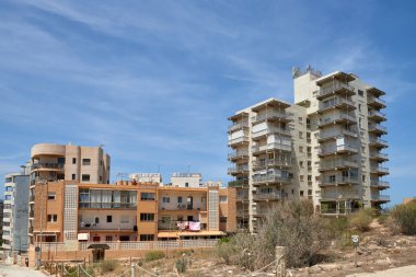 Eerie Landscapes of Spains Housing Bust: Incomplete Developments and Desolate Neighborhoods Under Vast Skies. Remnants of Spains Economic Downturn: Unoccupied Homes and Barren Skylines in clipart