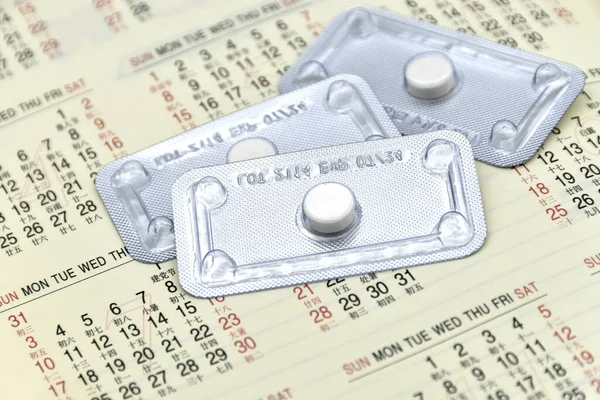 One tablet emergency contraceptive pill with calendar in English and Chinese language. The pill should be take immediately or within 72 hours for emergency contraception.