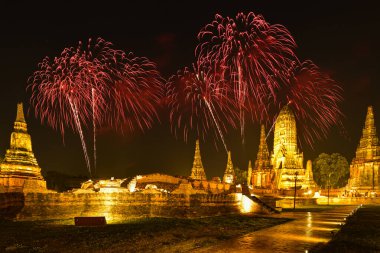 Fireworks with lighting-up of Wat Chaiwatthanaram, the ancient royal temple in Ayuthaya Historical Park, a UNESCO world heritage site in Thailand. clipart