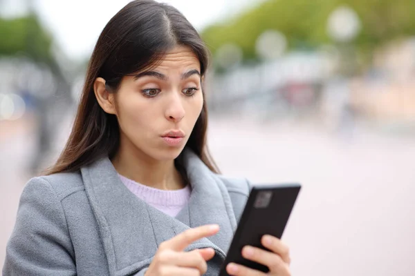 Upset Woman Saying Oops Watching Phone Content Street Winter — Stockfoto