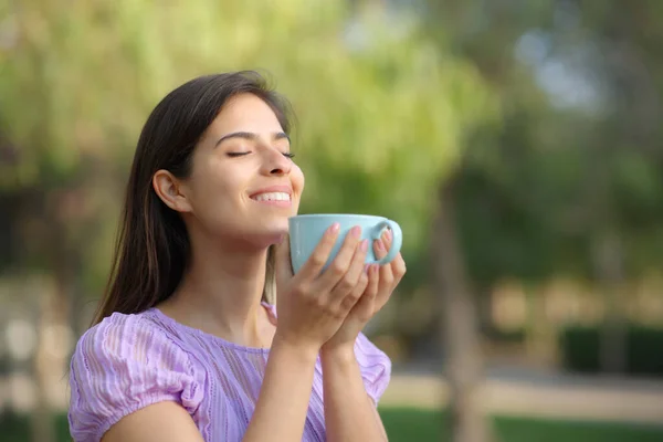 Happy Woman Holds Coffee Cup Smell Standing Park — Stock Photo, Image