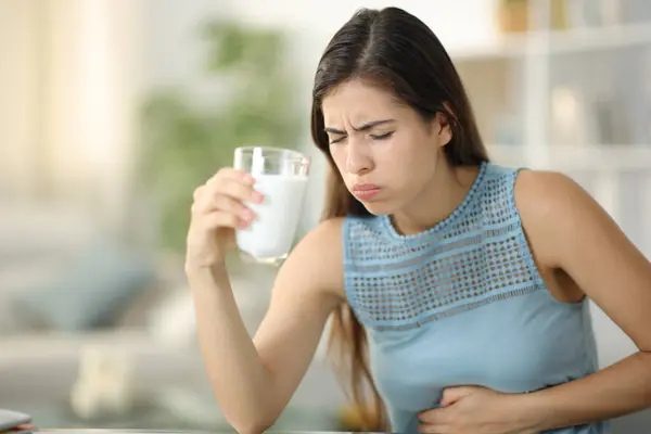 Woman Suffering Belly Ache Drinking Milk Home — Stock Photo, Image