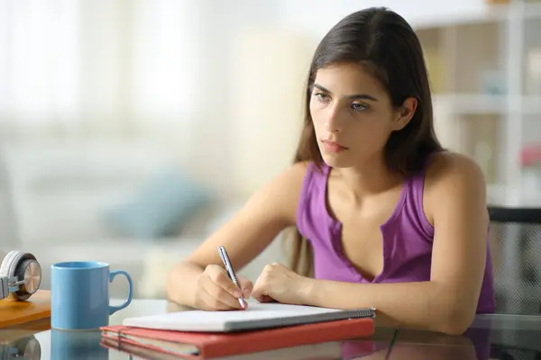 Demotivated Worried Student Taking Notes Looking Away Home — Stock Photo, Image