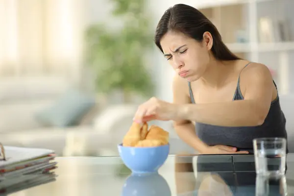 Glutton Woman Eating Croissants Suffering Belly Ache Home — Stock Photo, Image
