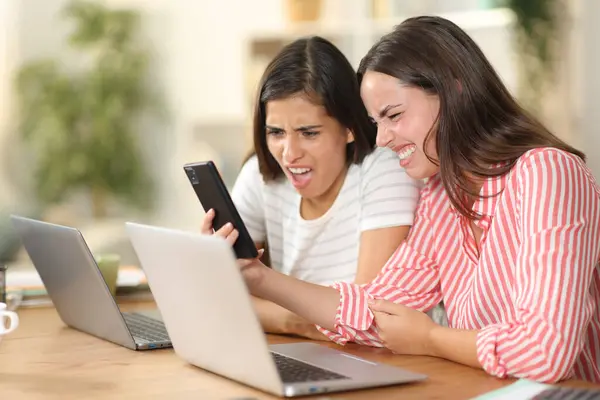 Two Disgusted Women Checking Nasty Content Phone Home — Stock Photo, Image