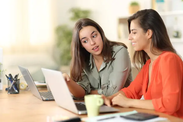 Two Tele Workers Talking Work Checking Laptop Content Home — Stock Photo, Image