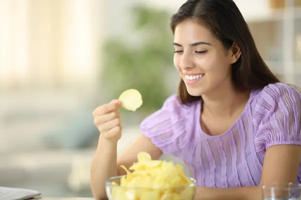 Happy Woman Eating Potato Chips Smiling Sitting Home — Stock Photo, Image