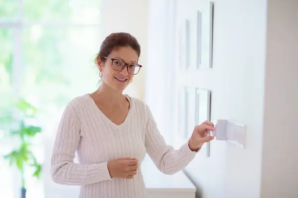 Woman Adjusting Thermostat Central Heating Comfortable Home Temperature Female Setting — Stok fotoğraf