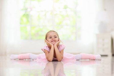 Baby ballet studio. Little ballerina in dance class. Cute girl in pink tutu and leotard learning to dance. Classic choreography for kids. Child dancer exercising. Kids practice full split.