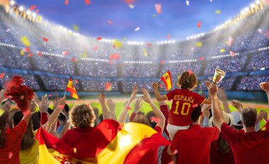 Stadyumdaki İspanya futbolu taraftarı. İspanyol taraftarlar futbol sahasında takımın maçını izliyorlar. Bayrak taşıyan ve ulusal forma giyen bir grup destekçi İspanya için tezahürat yapıyor. Şampiyonluk maçı. Hadi Espana.!