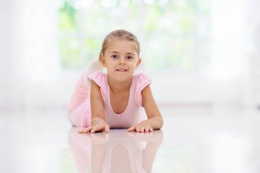 Baby ballet studio. Little ballerina in dance class. Cute girl in pink tutu and leotard learning to dance. Classic choreography for kids. Child dancer exercising. Kids practice full split.