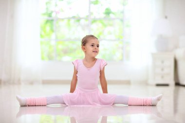 Baby ballet studio. Little ballerina in dance class. Cute girl in pink tutu and leotard learning to dance. Classic choreography for kids. Child dancer exercising. Kids practice full split.