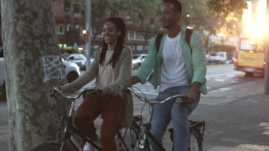 beautiful couple in love visiting the city on a bike ride - valentine's day - travelers -