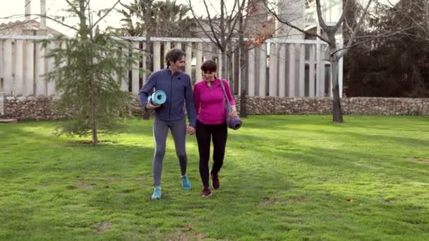 Mature Couple Walking Yoga Mats Park — Vídeos de Stock