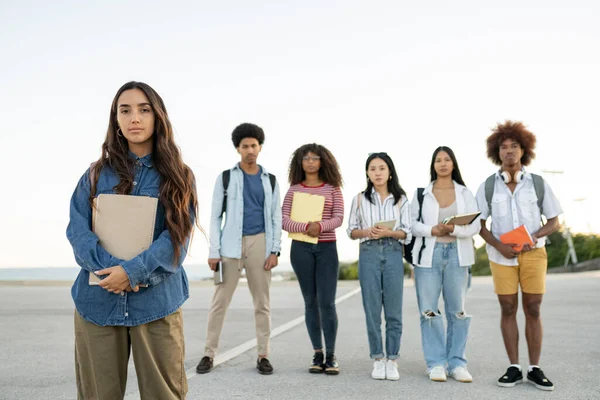 group portrait of young students -focus on hispanic woman-